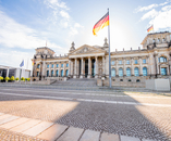 View on the famous Reichtag parliament building with flag during the morning light in Berlin city